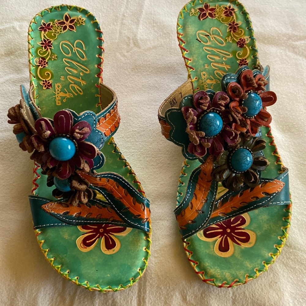 Elite sandals, by Corkeys.   Primary color is turquoise